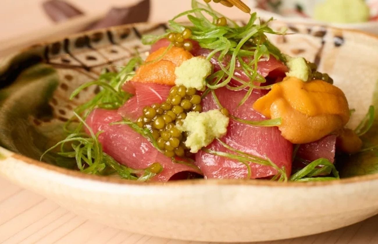 Yūgin’s bowl of marinated tuna topped with uni, fresh wasabi, sea greens, and caviar.