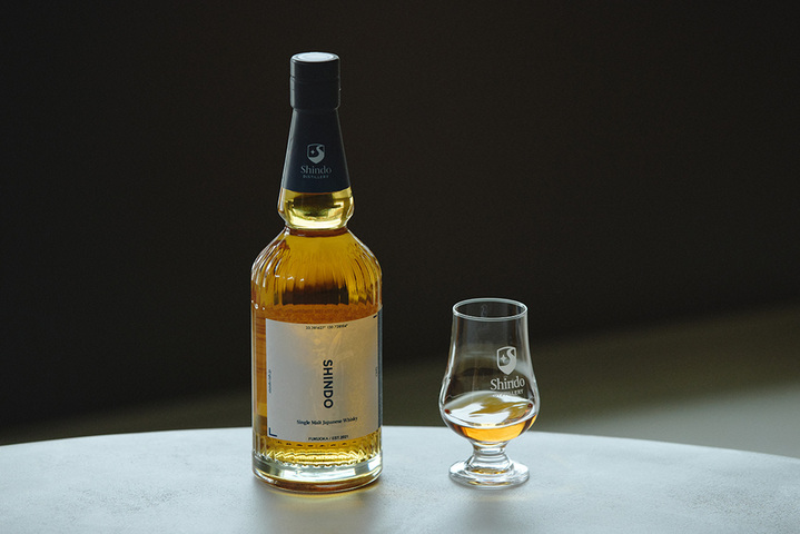 Bottle of Shindo Experimental 01 Japanese whisky with a tasting glass, showcasing the distillery’s fermentation-first philosophy.