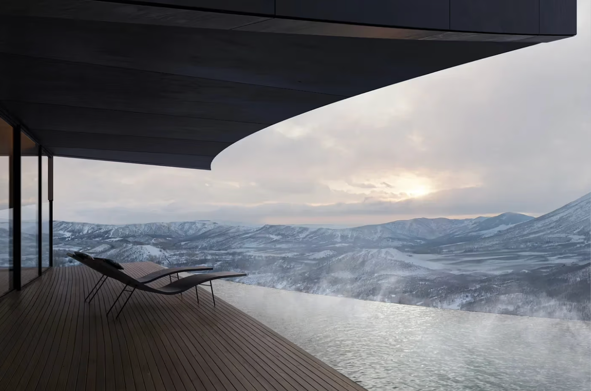 Contemporary architectural retreat with curved roof and panoramic mountain views